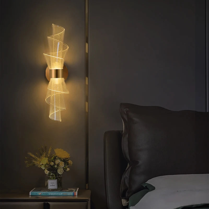 A sleek modern wall light featuring a stylish gold finish, perfect for contemporary home decor.