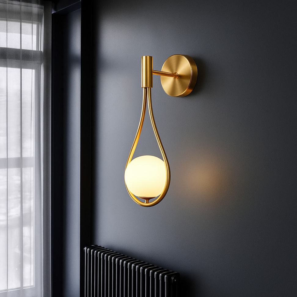 Bathroom globe light fixture with teardrop glass and solid brass base, delivering elegant illumination in modern vanity or sink areas.
