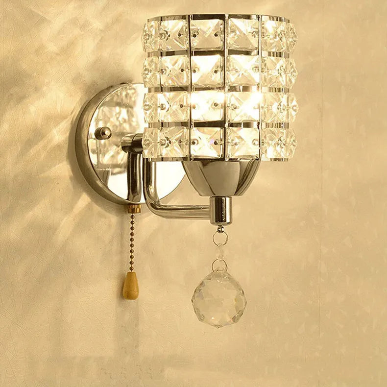 Elegant wall light with a crystal glass shade, known as the Crystal Basket wall sconce, adding a touch of sophistication.