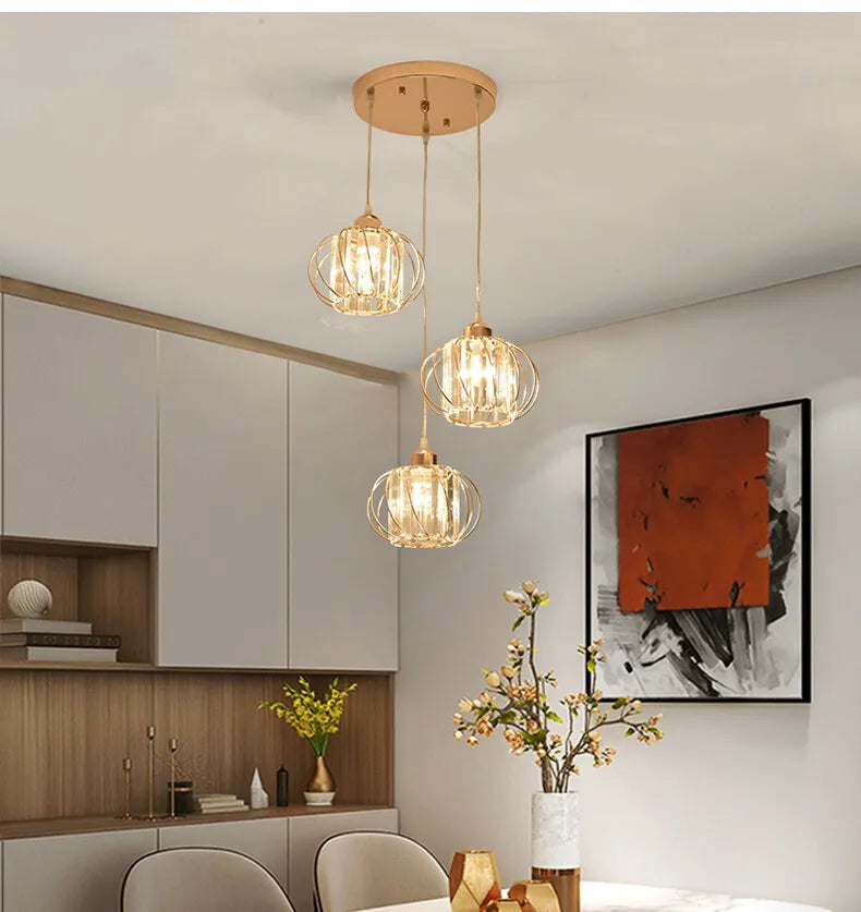 Modern pendant light with three glass balls hanging from the ceiling, adding a stylish touch to the room.