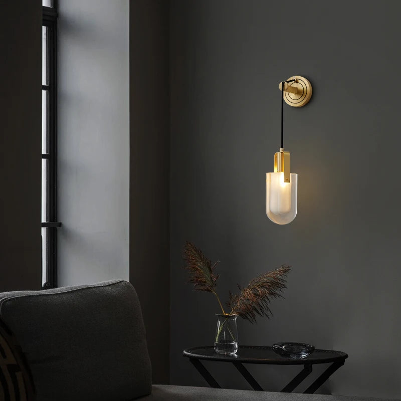modern frosted glass brass sconce near living room window