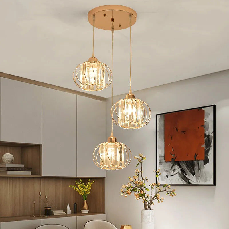 Modern pendant light featuring three glass orbs suspended from the ceiling, creating an elegant and contemporary ambiance.