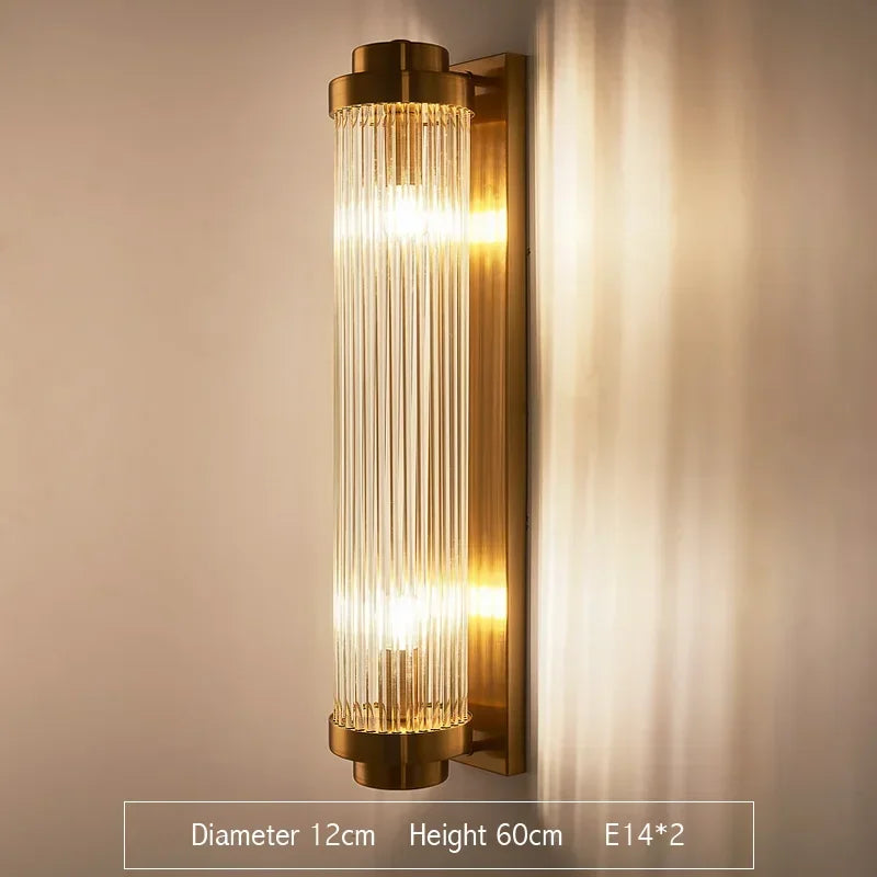 Tall cylinder-shaped wall sconce with ribbed crystal glass and brushed gold base, 60cm height and 12cm diameter. Features E14*2 bulbs, ideal for upscale entryways, corridors, or living rooms.