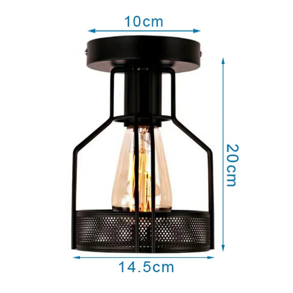 Industrial-style black metal flush mount light with mesh cage base and vintage bulb, 20cm tall and 14.5cm wide.