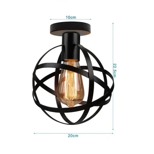 Industrial-style round ceiling light with black orbital cage design and exposed filament bulb perfect for loft and rustic interiors.