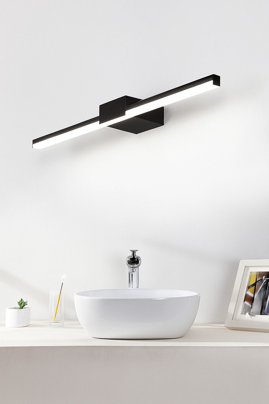 minimal-white-led-vanity-light-over-basin-on-white-wall-with-modern-decor