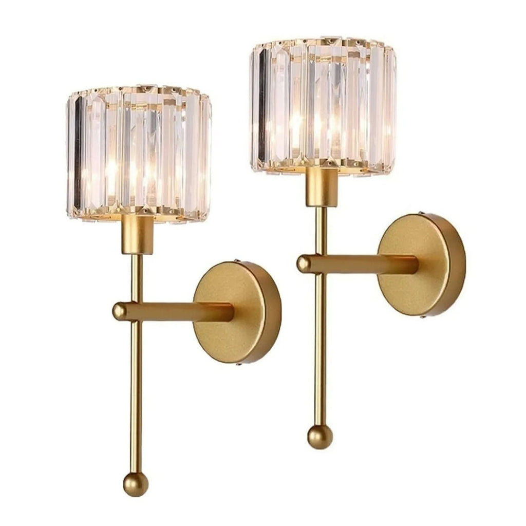 Two elegant gold wall lights featuring clear glass shades, adding a stylish touch to any room.