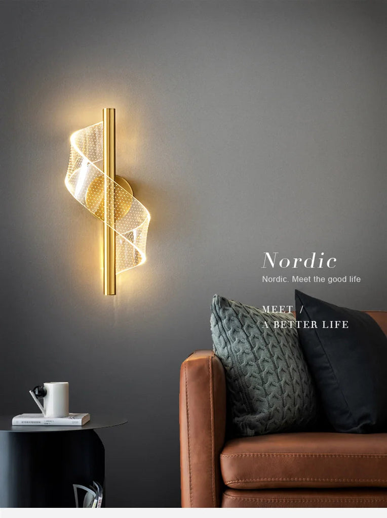 Gold wall light featuring a stylish spiral design, adding elegance to any room's decor.