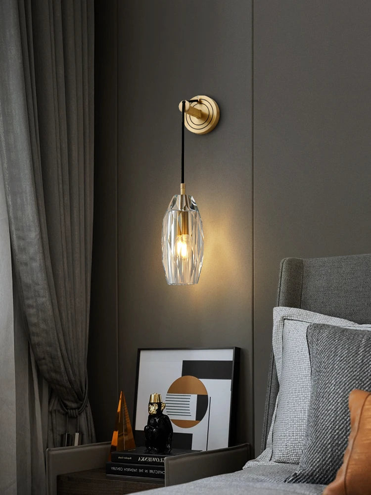 model n vintage crystal sconce beside bedroom artwork