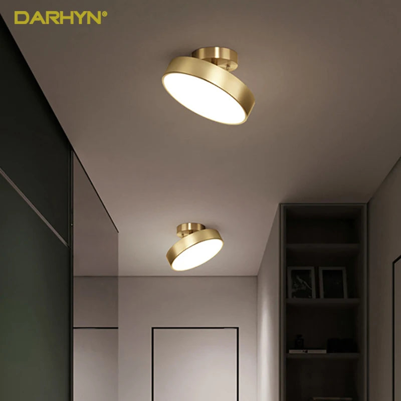 Sleek modern gold ceiling flush mount light with angled disc design, ideal for hallways, entryways, or bedrooms. Soft diffused LED lighting for contemporary interior decor.