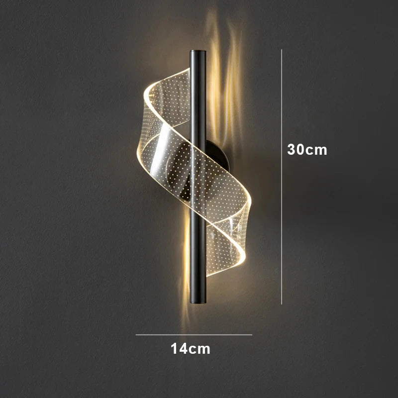 A modern wall light shaped like a spiral, featuring sleek lines and a contemporary design.