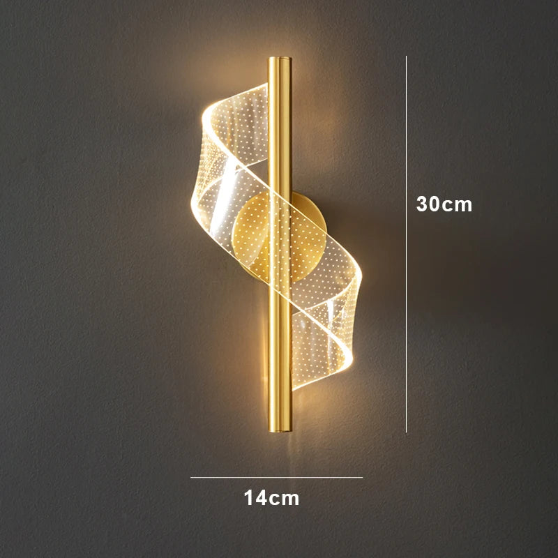 Stylish wall light made of gold, designed in a spiral shape to complement modern interiors.
