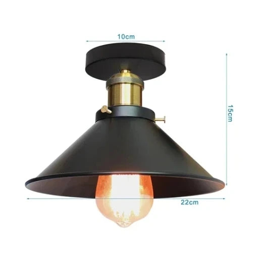 Vintage-style ceiling light with wide black metal shade, brass accents, and exposed Edison bulb perfect for industrial or retro décor.